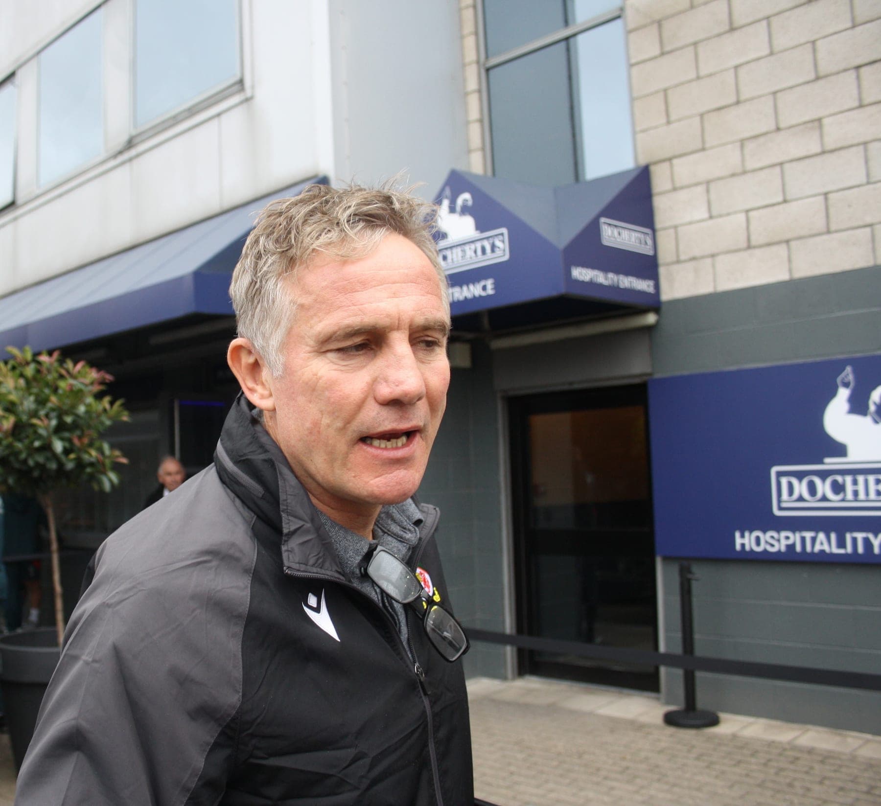 Phil Parkinson speaking outside the ground, August 2025