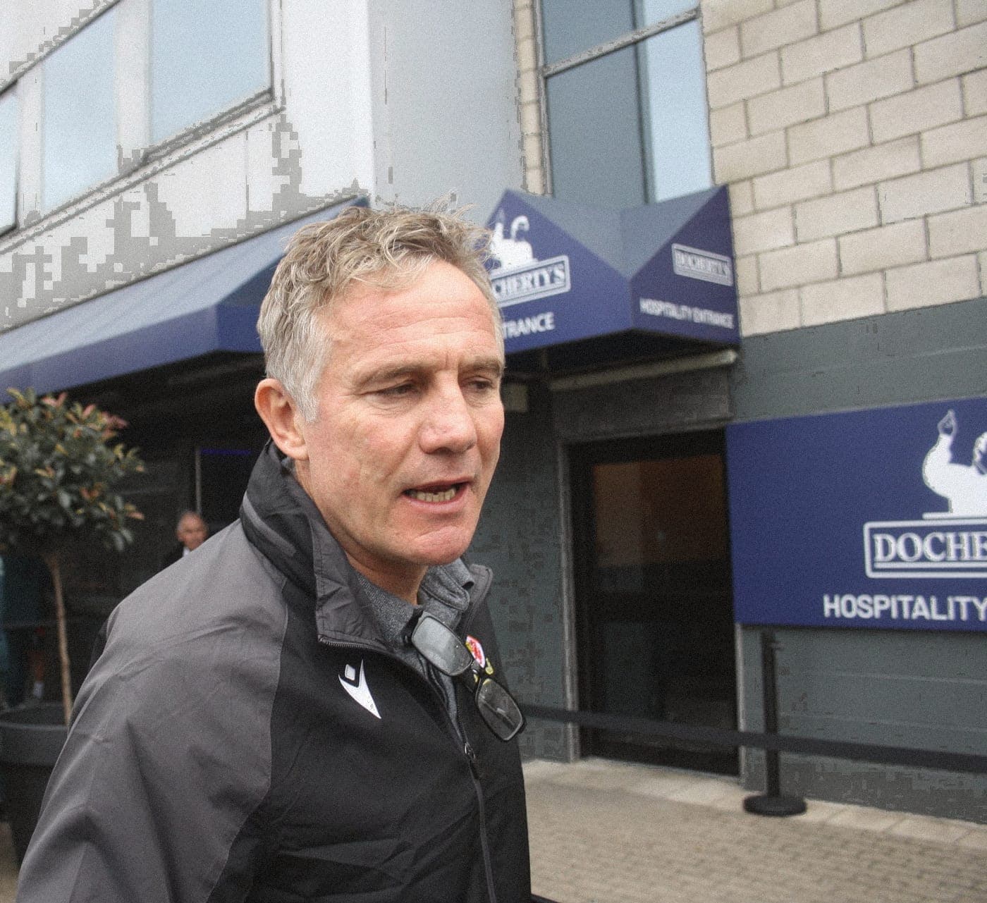 Phil Parkinson speaking outside the ground, August 2025