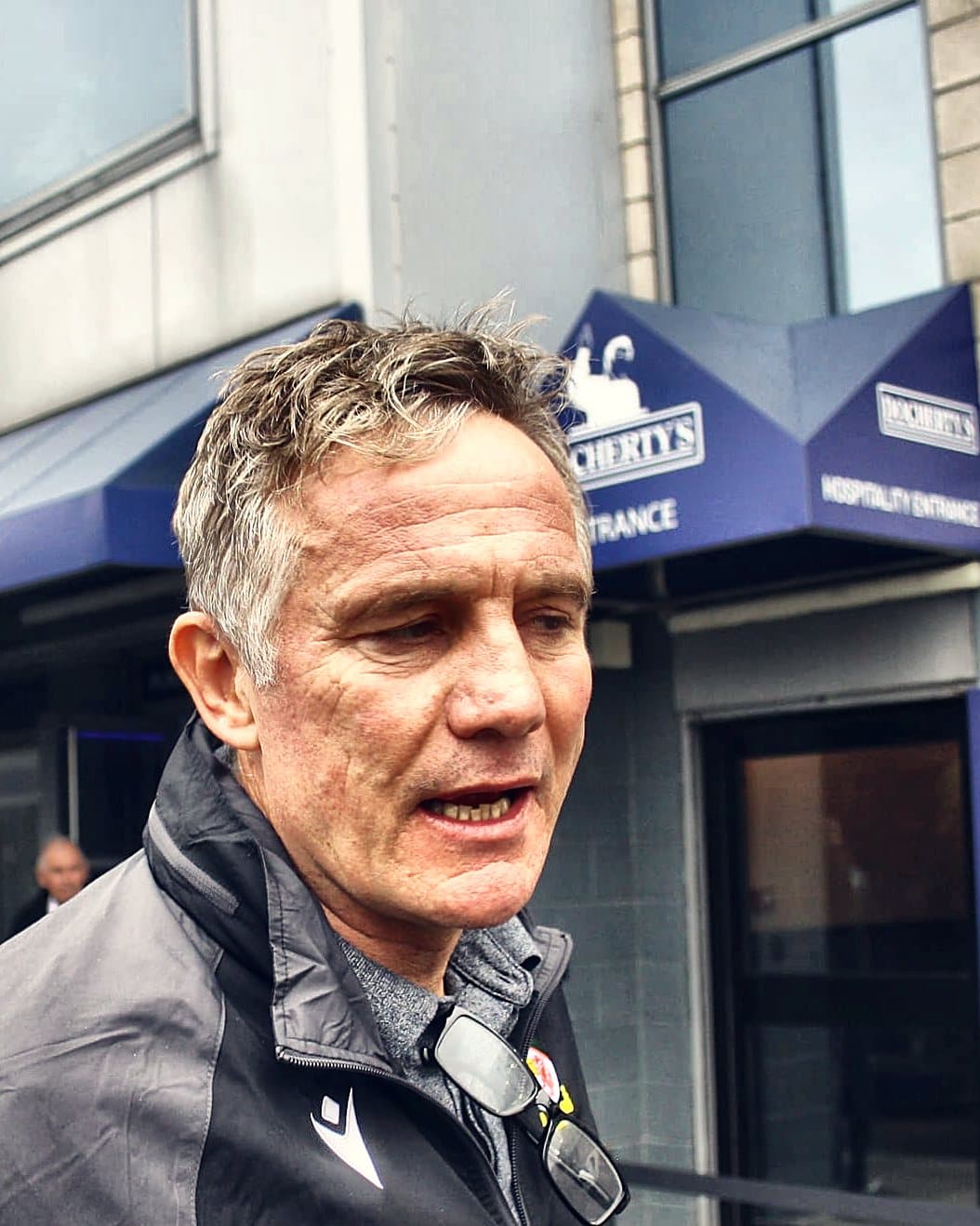 Phil Parkinson speaking outside the ground, August 2025