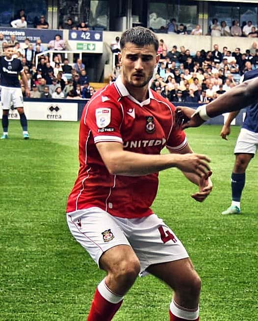 Wrexham closing down a Millwall player, August 2025